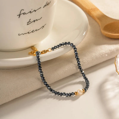 Pulsera de sodalita y perla azul marino