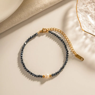 Pulsera de sodalita y perla azul marino