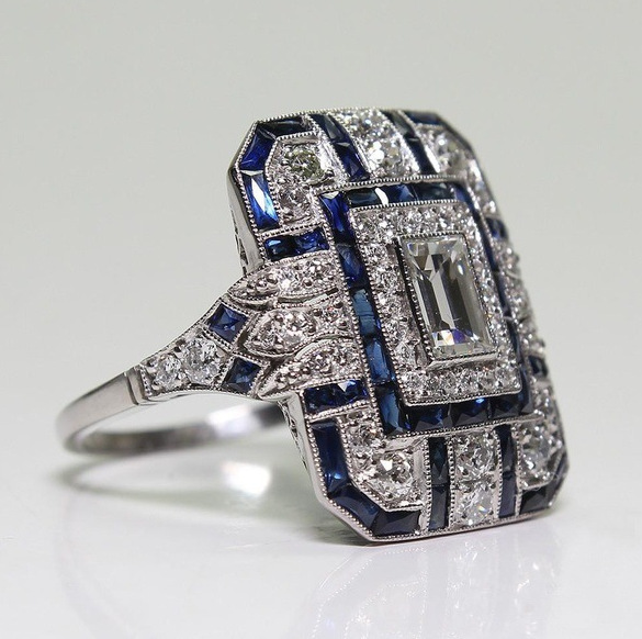 Anillo vintage en plata brillante y circonita azul.