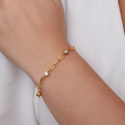 Pulsera Mónica con cristales y cadena dorada